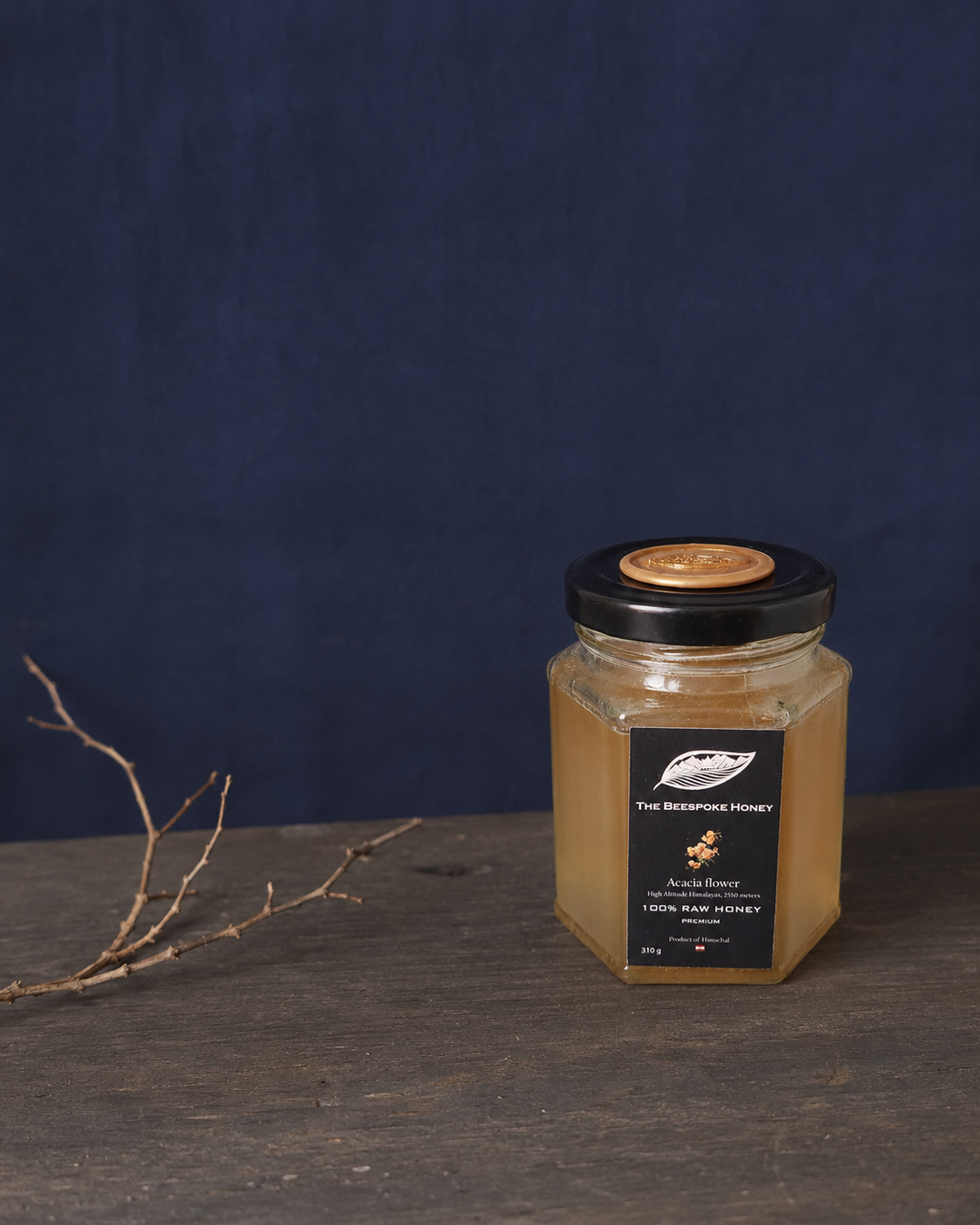 Himalayan Acacia Honey A2600 — raw single-origin monofloral honey in a hexagonal black jar, The Beespoke Honey