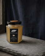 Chichri Alpine White Honey A3200 — rare single-origin Himalayan honey in a hexagonal black jar, The Beespoke Honey
